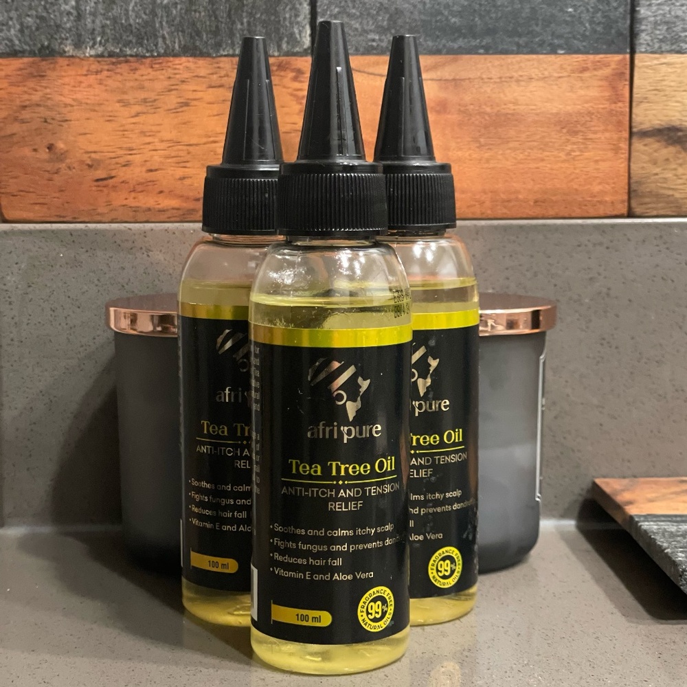 🌿 Revitalize Natural Hair with Afri Pure Tea Tree Hair Oil - Nature's Solution